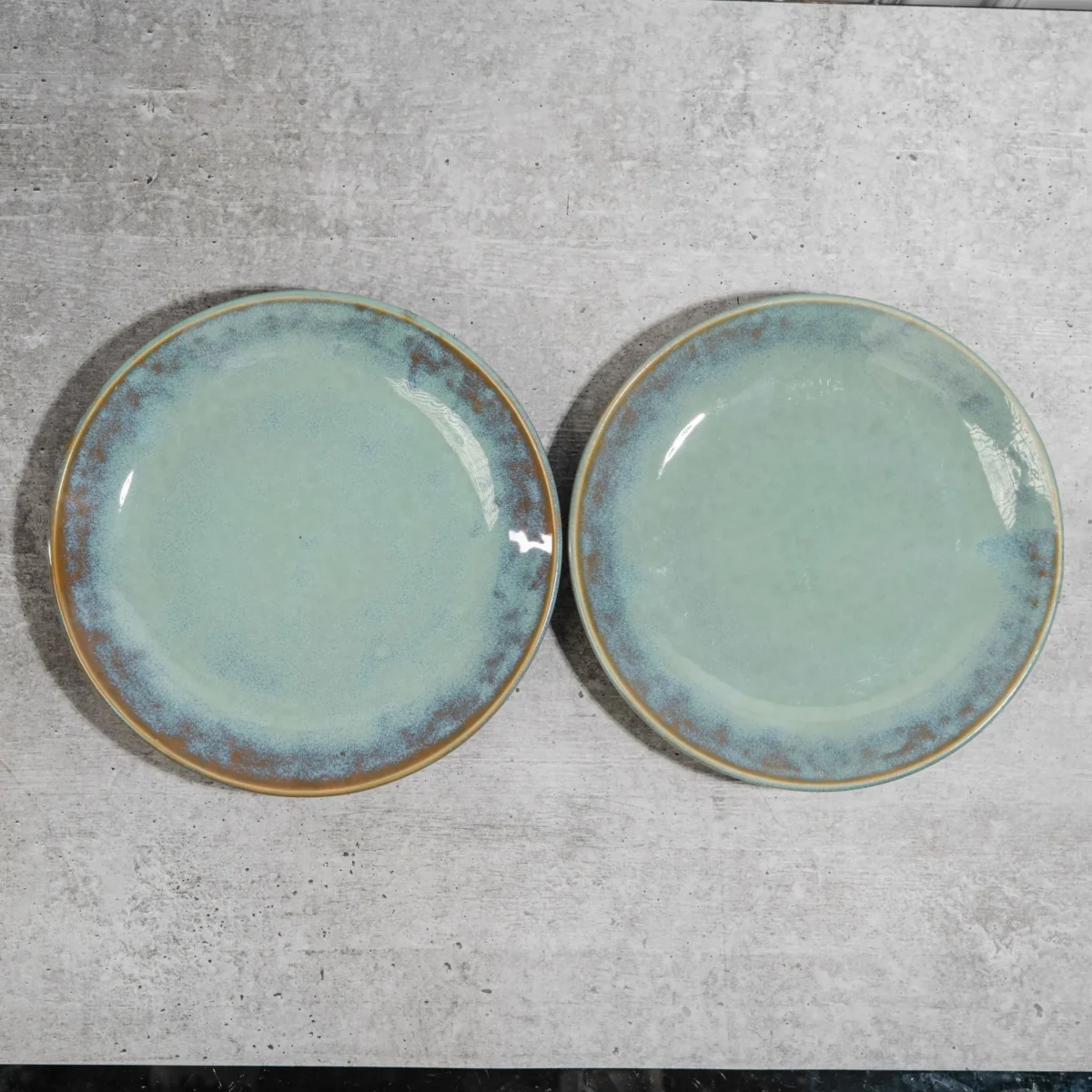 Maravine Ceramic Dinner Plates – Set of 2 handcrafted 10-inch plates with aqua-brown glaze. Microwave & dishwasher safe. Perfect for dining & gifting.
