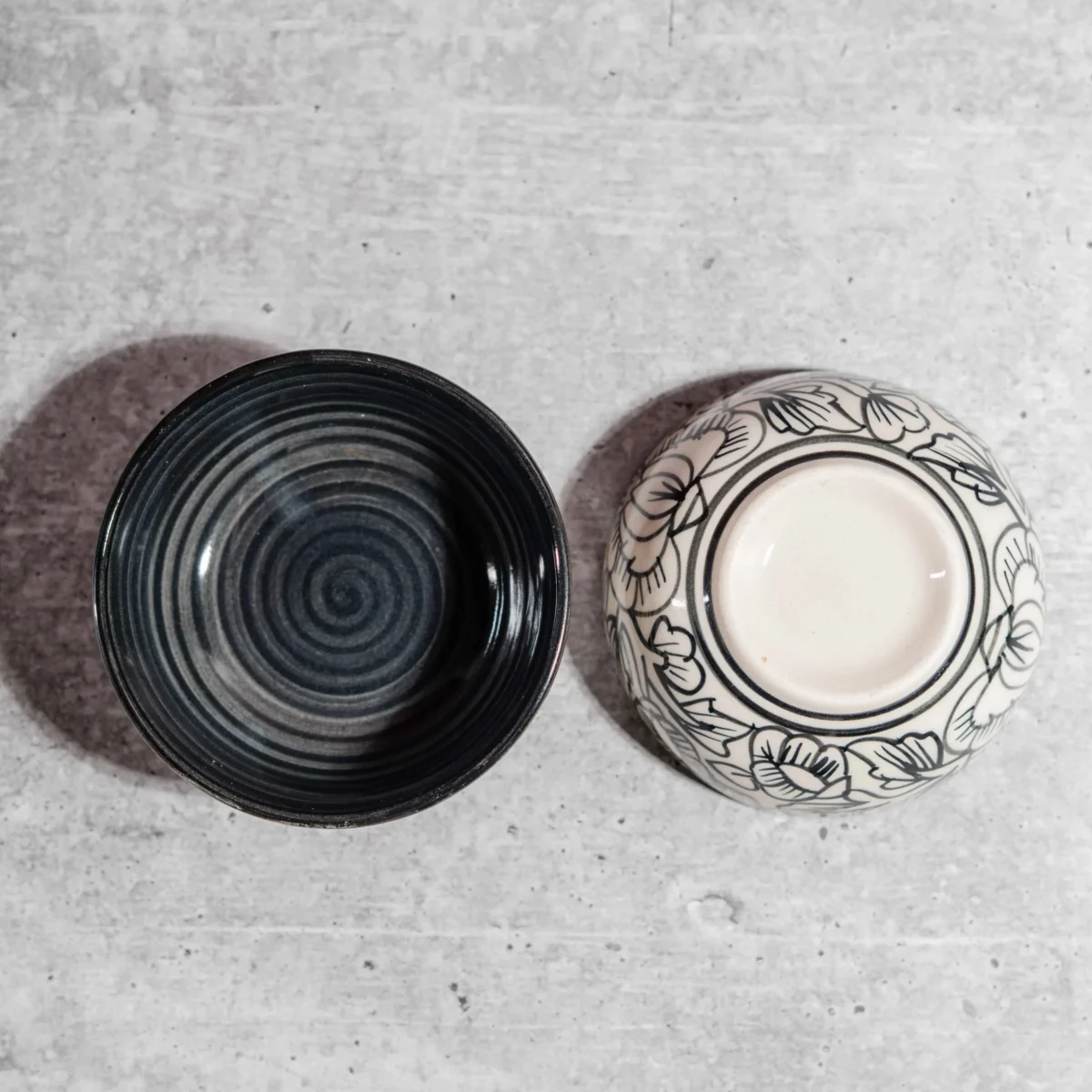 Monarca Ceramic Katori Bowls – Set of 2 by Harmiche. Hand-painted black floral design, microwave & dishwasher safe. Perfect for curries, dal & desserts.