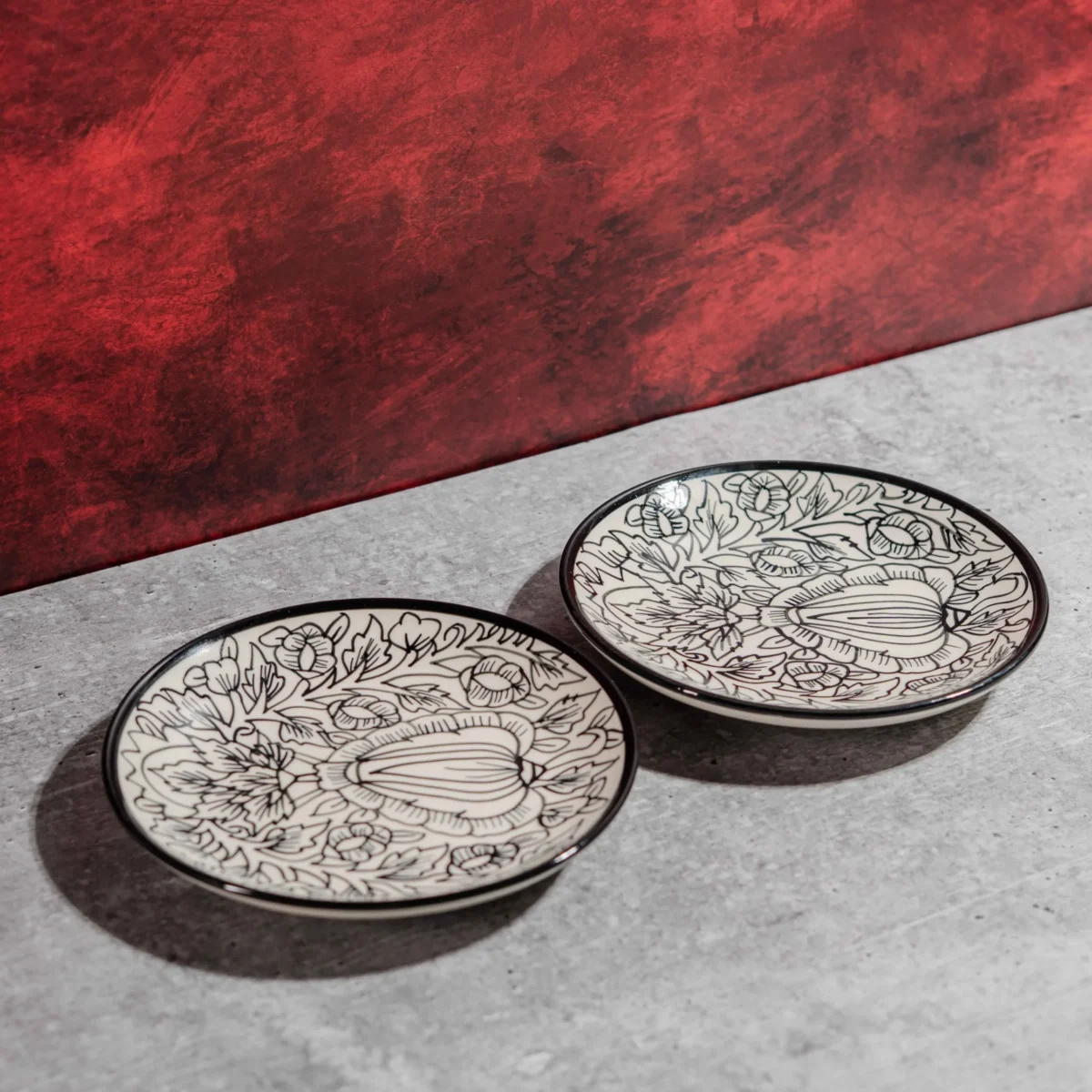 Monarca Ceramic Quarter Plates – Set of 2 (7 inches) by Harmiche. Hand-painted black floral design, microwave & dishwasher safe. Perfect for sides & desserts.