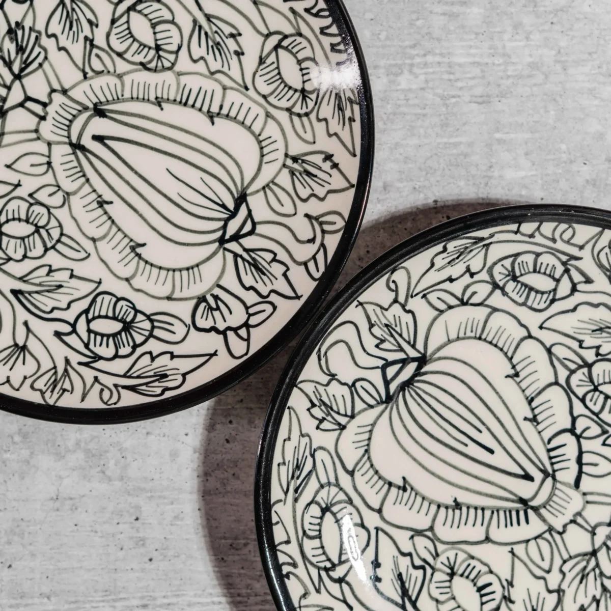 Monarca Ceramic Quarter Plates – Set of 2 (7 inches) by Harmiche. Hand-painted black floral design, microwave & dishwasher safe. Perfect for sides & desserts.