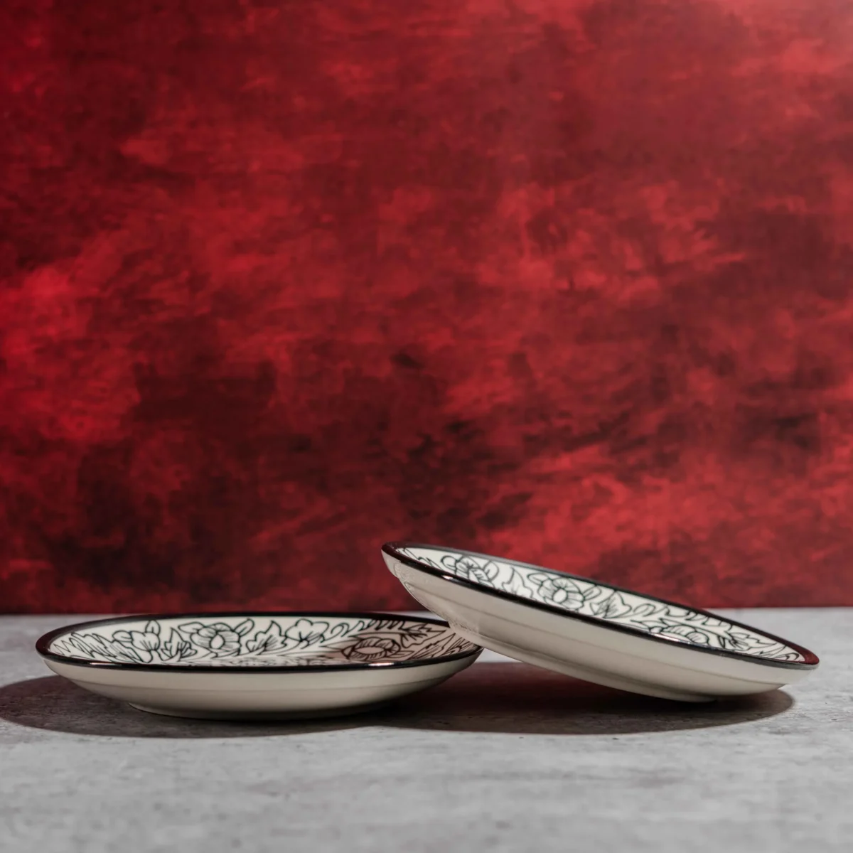 Monarca Ceramic Quarter Plates – Set of 2 (7 inches) by Harmiche. Hand-painted black floral design, microwave & dishwasher safe. Perfect for sides & desserts.