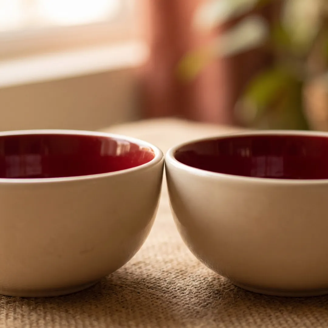 Harmiche Crimson Ember Ceramic Soup Bowls Set of 2 – 300ml, deep red glaze, matte cream exterior, handcrafted. Food safe. Shop now.