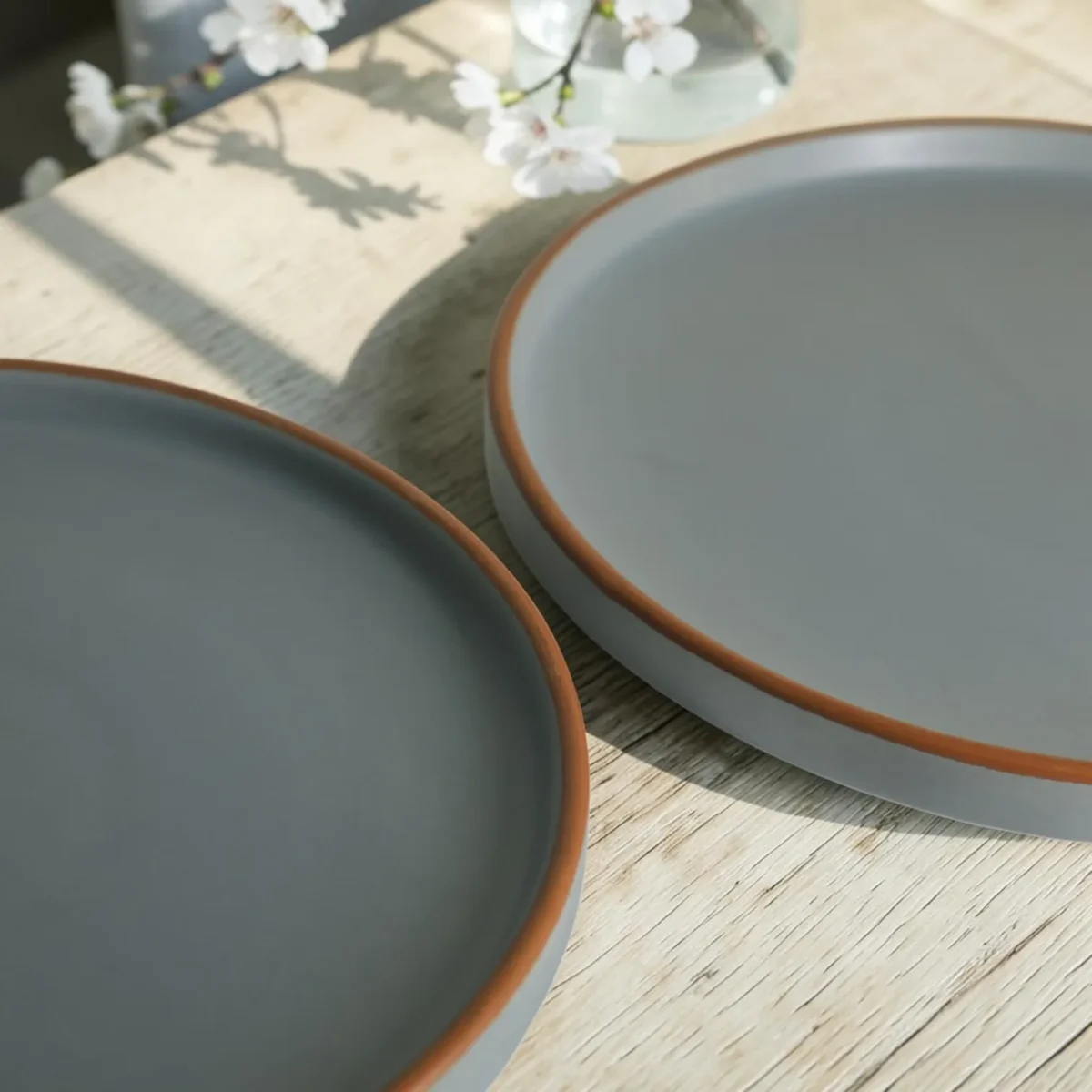 Harmiche Signature Grey Stoneware Dinner Plate, 10 inch | Matte slate, terracotta rim. Single, Set of 2, 4 & 6. Oven & dishwasher safe. Shop.